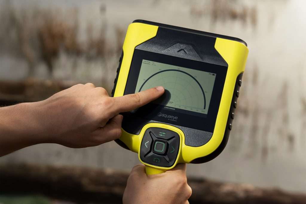 person pointing to Aquaeye